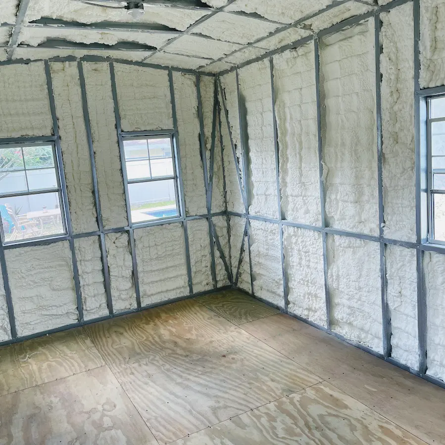 Closed-cell spray foam insulation applied to wall cavities in a residential project in Granby